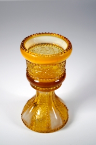 Photo of a pedestal footed, 1903, toothpick holder. Holly Amber pattern.